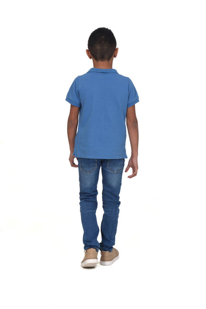 rear view of a teen walking on white - Photo, Image