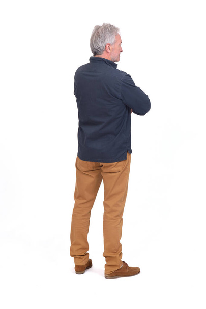 side and back view of a man arms crossed on white. background - Foto, afbeelding
