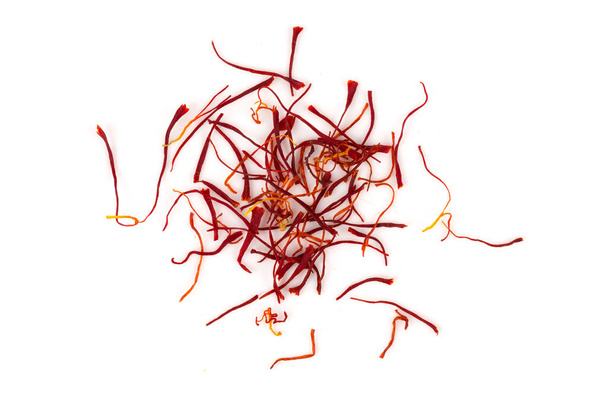 Dried saffron spice pieces isolated on a white background - Fotografie, Obrázek