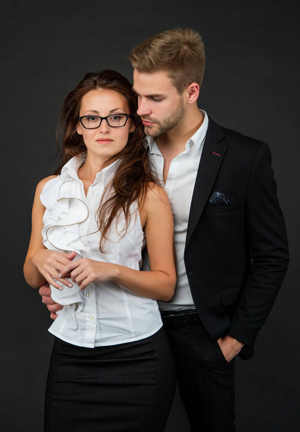 business partners on black background. formal couple in love. businessman and businesswoman. - Φωτογραφία, εικόνα