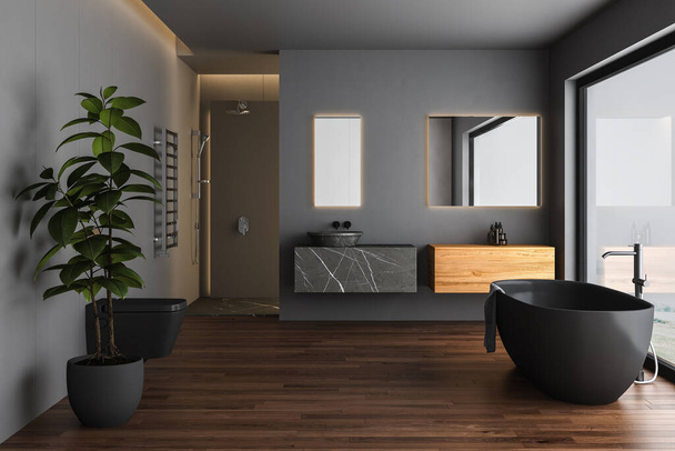 Dunkles Badezimmer mit schwarzem Parkettboden, schwarzer Badewanne, schwarzer Toilette und quadratischen Spiegeln, Dusche, Frontansicht. Minimalistisches schwarzes Badezimmer mit modernen Möbeln. 3D-Darstellung - Foto, Bild