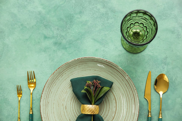 Elegant table setting on green background - Photo, Image
