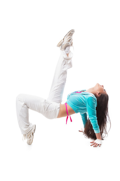 Young modern flexible hip-hop dance girl bends backwards bridge pose with hanging hair.  - Fotografie, Obrázek
