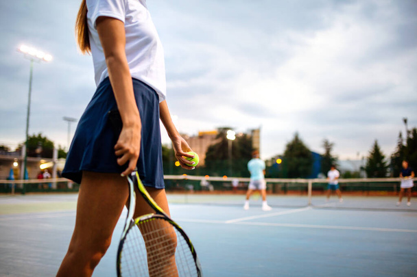 Portrait of happy fit young woman playing tennis at summer. People sport healthy lifestyle concept - Fotografie, Obrázek