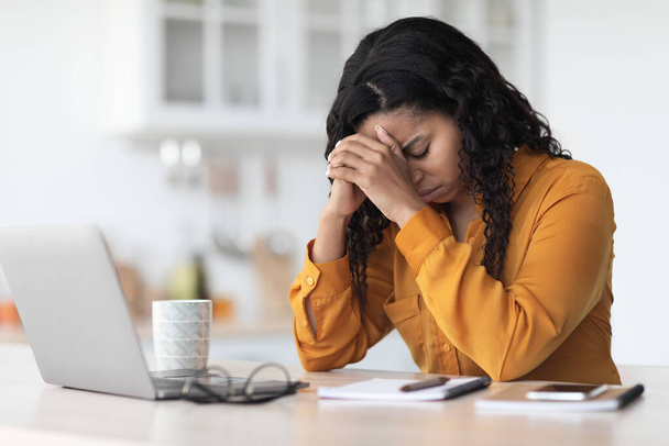 Tired african american lady experiencing burnout, working online - Foto, immagini