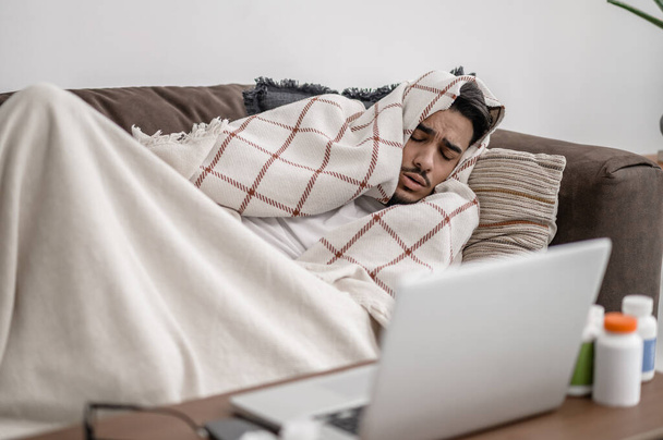 A sick man feeling bad and lying in bed - Фото, зображення