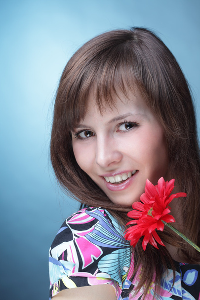 Young woman with artificial flower - Photo, image