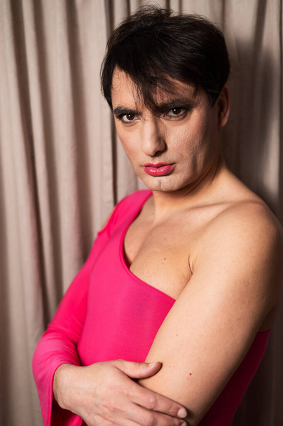 Homosexual in a pink female dress. A man in make-up. - Photo, Image