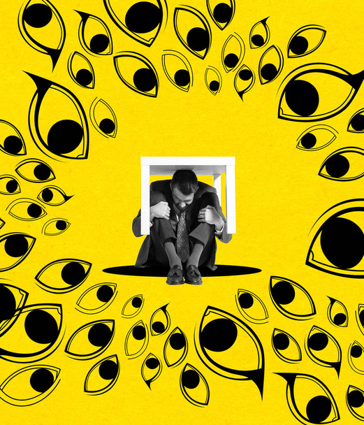 Contemporary art collage. Desperate man sitting, hiding under table from social pressure isolated over yellow background - Foto, Imagem