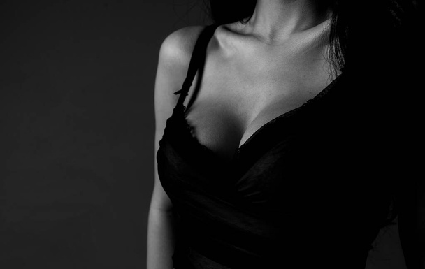 Women with large breasts. Sexy breas, boobs in bra, sensual tits. Beautiful slim female body. Lingerie model. Closeup of sexy female boob in black bra. - Fotografie, Obrázek