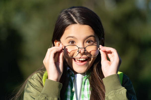 amazed kid with backpack wear glasses. back to school - 写真・画像
