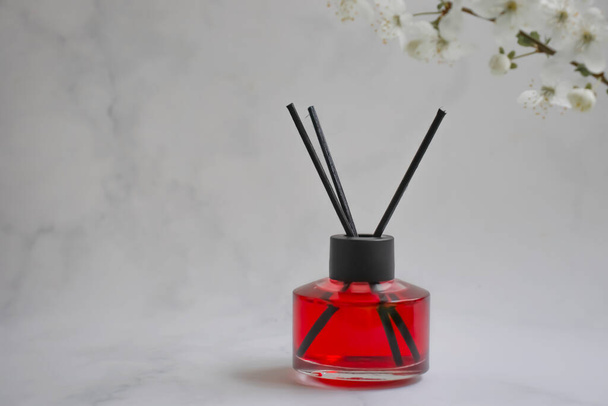 Perfume for home flower on a light background - Foto, imagen