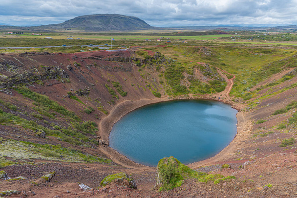 Blue volcanic lake at Kerid crater on Iceland - Fotoğraf, Görsel