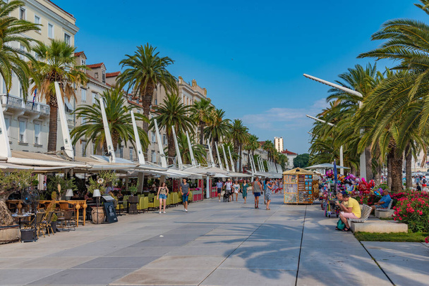 Split, Croatia, July 23, 2020: People are walking on seaside promenade in Split, Croatia - Foto, afbeelding