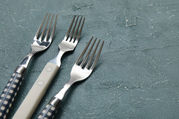 Different forks on grey background, closeup - Фото, изображение
