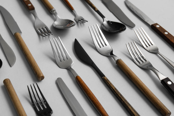 Many different cutlery on grey background - Photo, Image