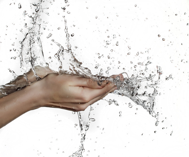 Woman hand in water splash - Foto, afbeelding