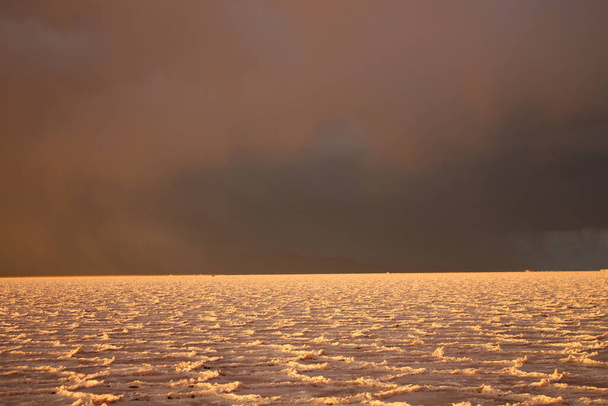 Storm at salt flat desert on sunset - 写真・画像
