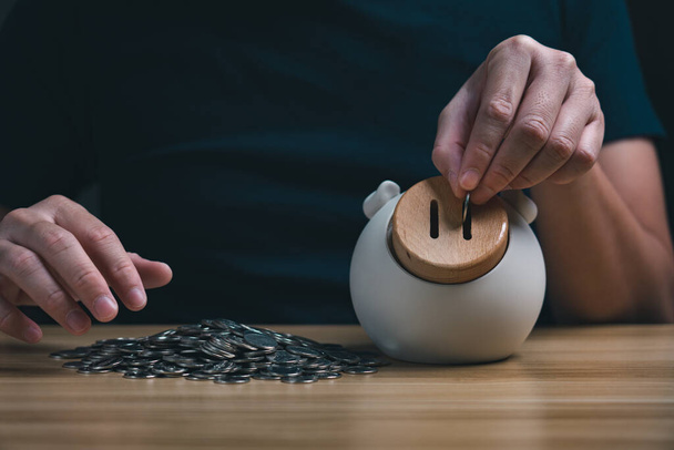 save money concept, businessman keeping money in a piggy bank. financial planning, save money for the future, Savings and pensions - Fotografie, Obrázek