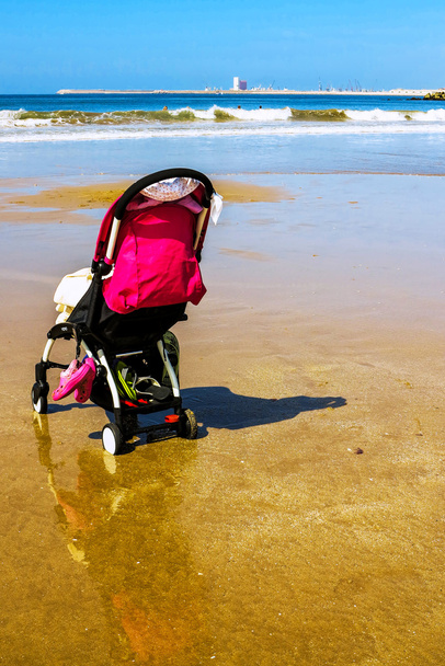 Lonely stroller on beach at low tide - Photo, Image