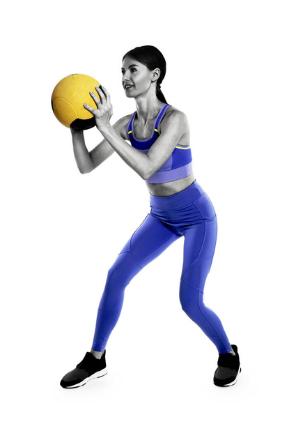 Athletic woman doing exercise with medicine ball isolated on white - Fotoğraf, Görsel