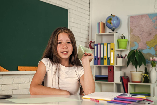 a little break. formal and nonformal education. schoolgirl at lesson. child hold paper plane. - Fotoğraf, Görsel