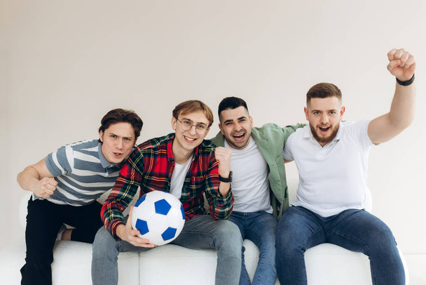 A group of friends watching a football match on TV. Football Fans - Фото, изображение