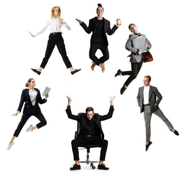 Young office workers jumping and dancing in busness style clothes or suit with folders and gadgets on white background. Creative collage. - Foto, Imagem