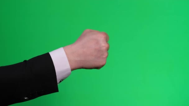 Zöld hátterű gesztusok. Férfi kéz ököl veri Chromakey - Felvétel, videó