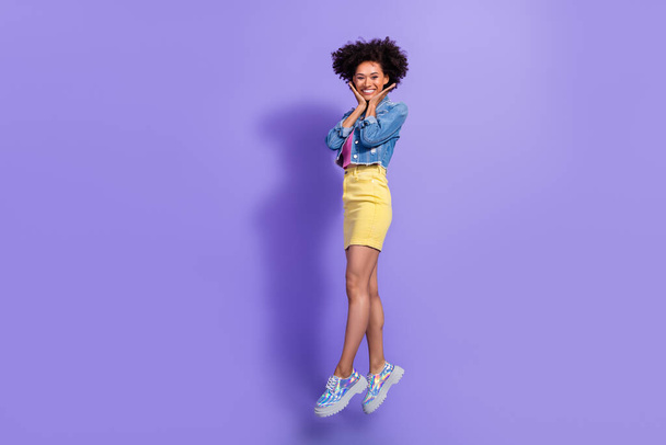 Full length body size view of attractive funny cheery girl jumping good mood isolated over bright violet purple color background - Фото, изображение