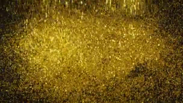 Arany por, csillogás esik a fekete háttérben, és formák domb. - Felvétel, videó