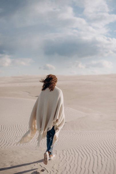 person walking on the sand dunes - Фото, зображення