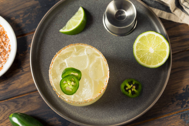 Boozy Spicy Jalapeno Margarita with Tequila and Lime - 写真・画像
