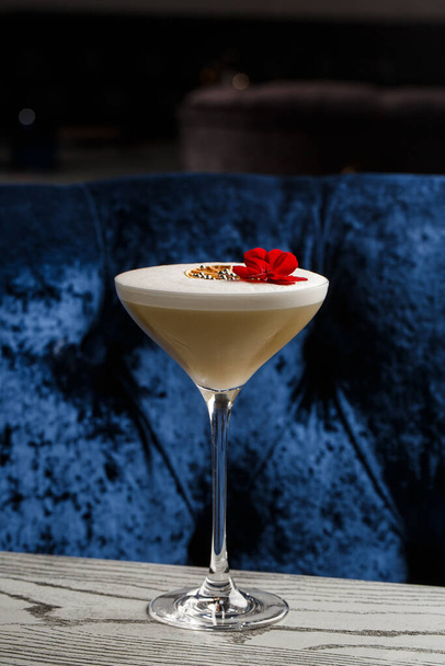 Coffee cocktails and liquor on blue reflective background. Copy space for your text - 写真・画像