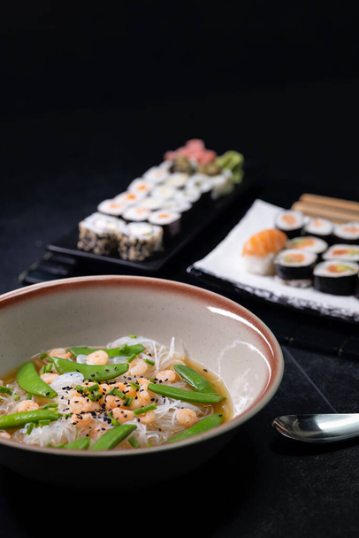 Various dishes of Asian cuisine with typical sushi - Photo, Image