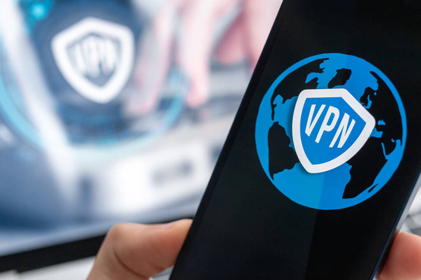 Person uses VPN application on smartphone. Virtual private network, anonymous, safe and secure internet access on mobile phone. Desktop banner, technology background  - Foto, Imagen