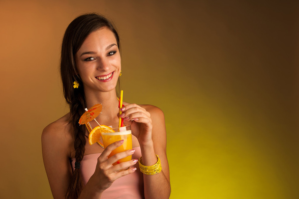 Girl drinks a cocktail in night club - 写真・画像