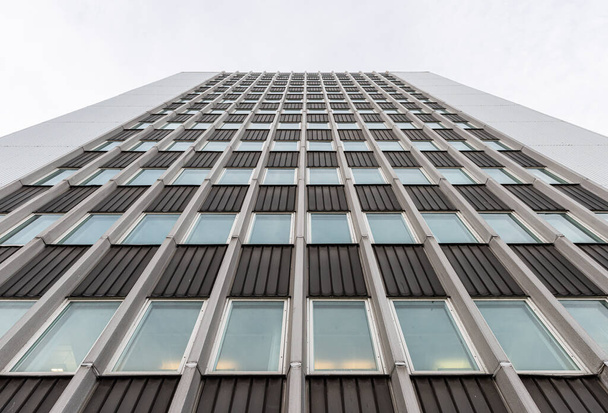 Gothenburg, Sweden - January 10 2021: Looking up tall glass and concrete office high-rise building. - Foto, immagini