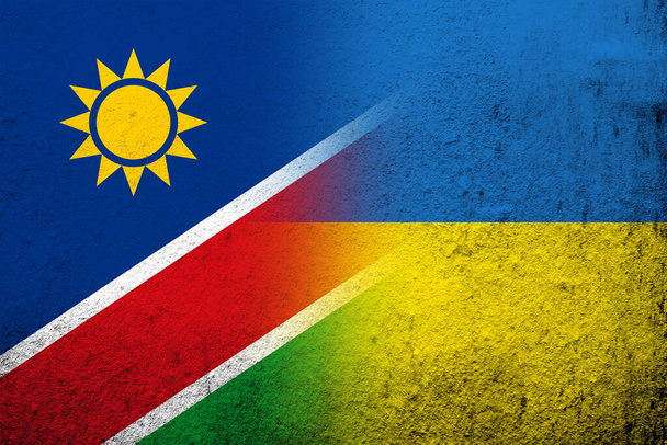 De nationale vlag van Namibië met de nationale vlag van Oekraïne. Grunge achtergrond - Foto, afbeelding