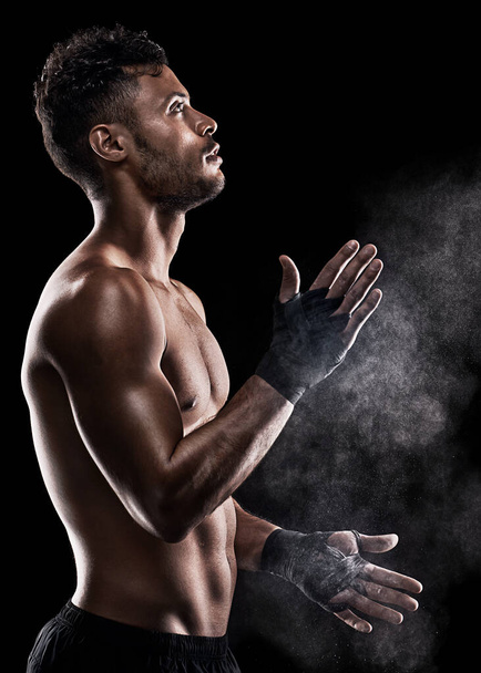 You Have the Power to Fulfill Your Dreams. Cropped shot of a man dusting powder on his hands as he prepares to box. - Foto, immagini