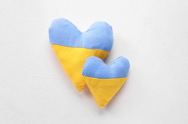 Hearts in colors of Ukrainian flag on light background - Photo, Image
