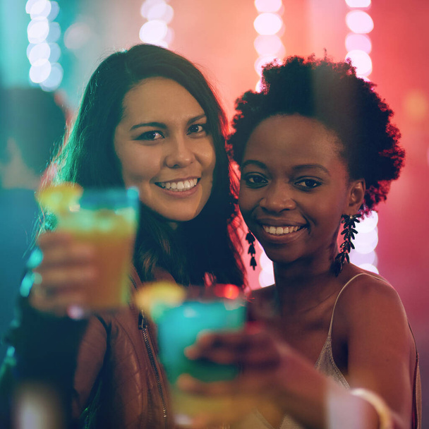 We came to have a good time. Portrait of two friends in a nightclub. - Zdjęcie, obraz
