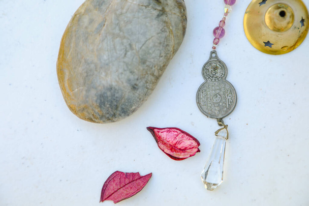 Flat lay image featuring chinese coin for good luck, rocks and crystals - Foto, imagen
