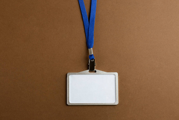 Blank badge on brown background, top view. Mockup for design - Foto, imagen