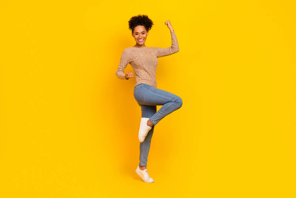 Full size photo of young excited lady rejoice luck triumph fists hands champion isolated over yellow color background - Фото, зображення