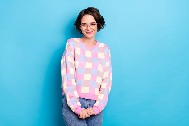 Photo of cute millennial brunette lady hold palms wear plaid sweater jeans isolated on vivid blue color background - Φωτογραφία, εικόνα