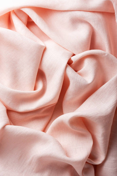 Wavy linen fabric in pink petal color, selective focus image - Φωτογραφία, εικόνα