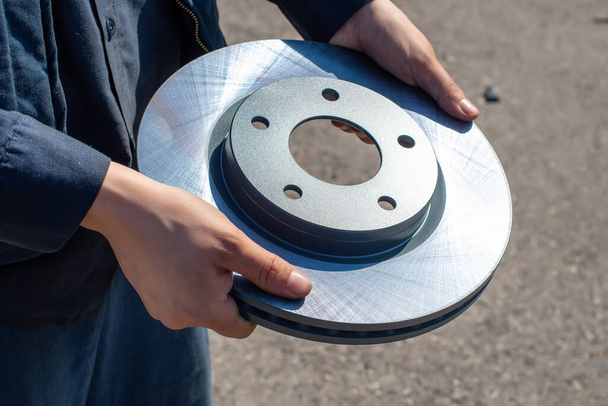 brake disc in the hands of a mechanic - Photo, Image