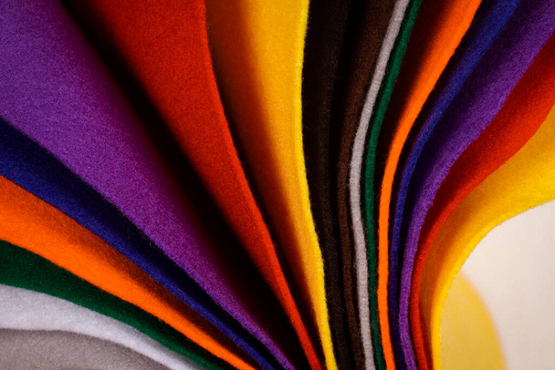 Several colored felt texture background. Assorted color felt fabric sheets, patchwork, sewing DIY craft - Foto, Imagem