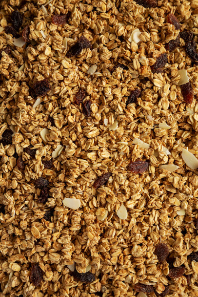 Homemade Granola with raisins and almonds background, top view.  - Фото, изображение